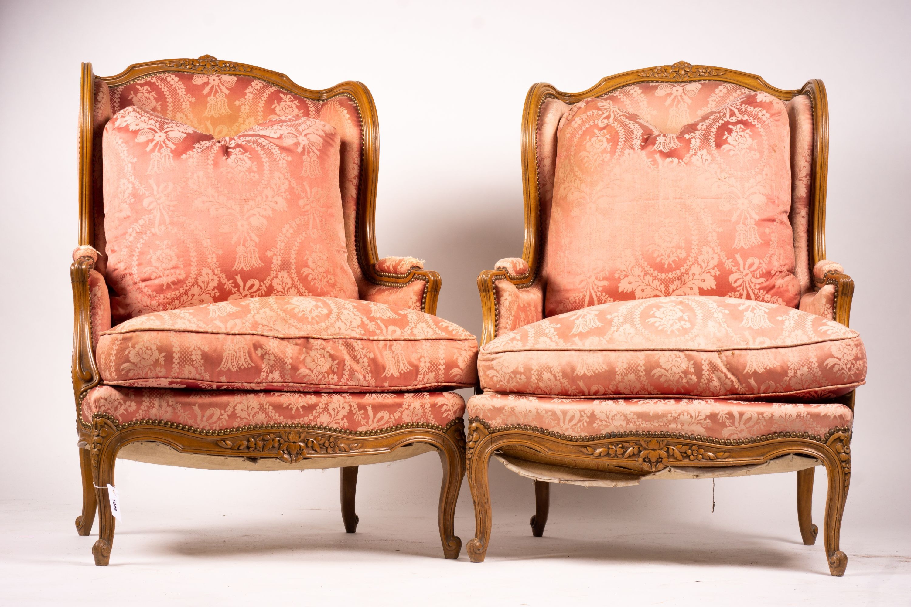 A pair of early 20th century French carved beech armchairs, width 75cm, depth 78cm, height 110cm